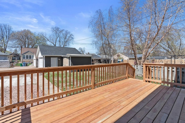 4015 Queen Ave N, Minneapolis, MN 55412 - wooden deck featuring fence, a garage, and a residential view