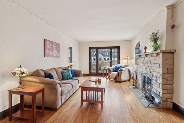 300 Diamond Lake Rd, Minneapolis, MN 55419 - living room with baseboards, arched walkways, wood finished floors, and a fireplace