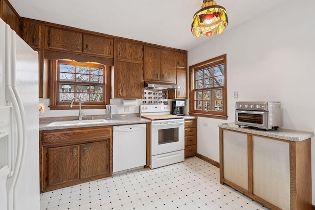 300 Diamond Lake Rd, Minneapolis, MN 55419 - kitchen with a sink, a wealth of natural light, white appliances, under cabinet range hood, and light floors