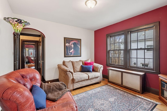 300 Diamond Lake Rd, Minneapolis, MN 55419 - living area featuring arched walkways, light wood-style flooring, and baseboards