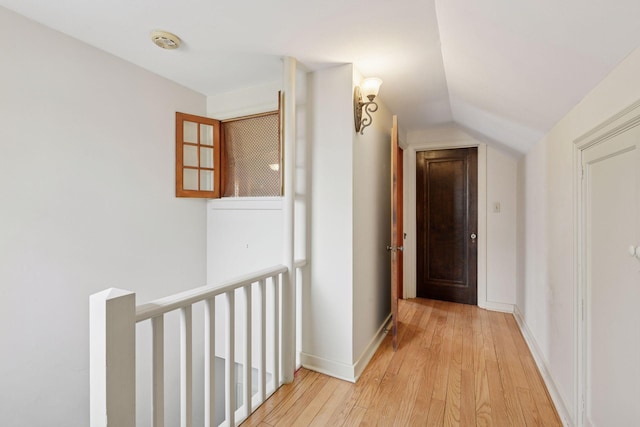 300 Diamond Lake Rd, Minneapolis, MN 55419 - corridor with baseboards, an upstairs landing, light wood-type flooring, and vaulted ceiling