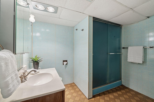 300 Diamond Lake Rd, Minneapolis, MN 55419 - bathroom featuring tile patterned floors, vanity, tile walls, and a stall shower