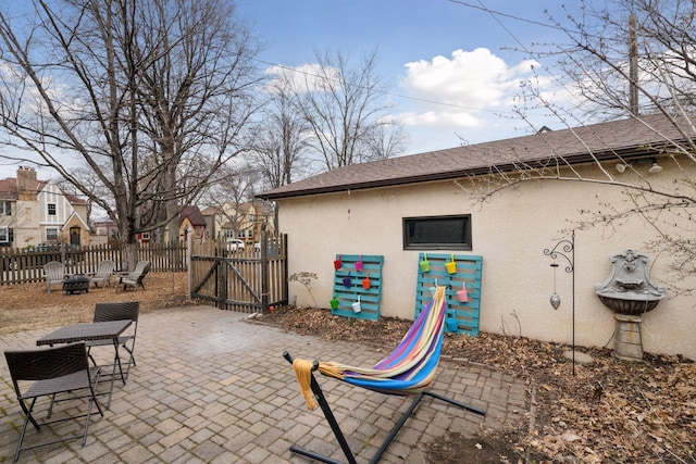 300 Diamond Lake Rd, Minneapolis, MN 55419 - view of patio with an outdoor fire pit, fence, and a gate