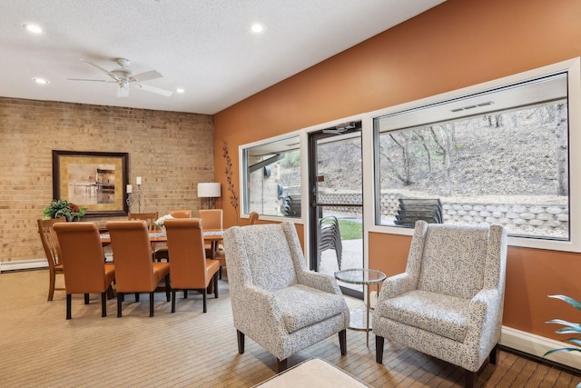 living area featuring baseboards, recessed lighting, wood finished floors, and a ceiling fan