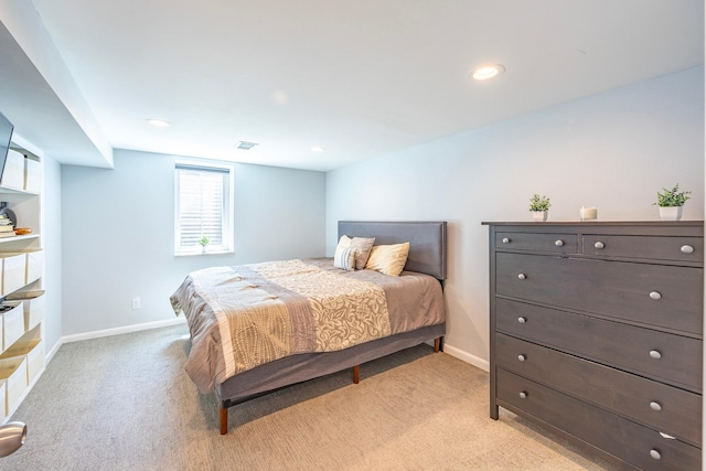 bedroom featuring light colored carpet, baseboards, and recessed lighting