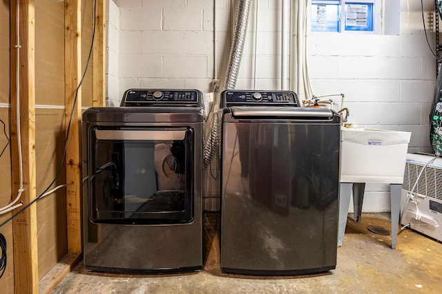 washroom with separate washer and dryer