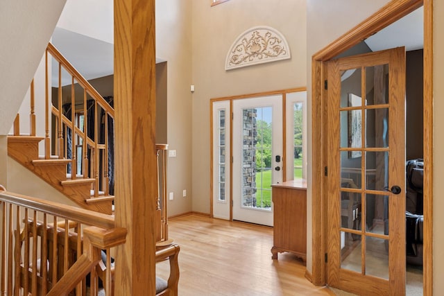 268 Saint Andrews Dr, Hudson, WI 54016 - entryway featuring wood finished floors, stairs, and a towering ceiling