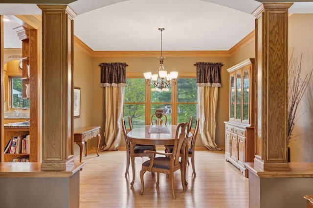 268 Saint Andrews Dr, Hudson, WI 54016 - dining area featuring ornate columns, ornamental molding, light wood-style flooring, and baseboards