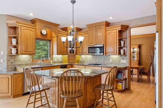 268 Saint Andrews Dr, Hudson, WI 54016 - kitchen featuring open shelves, stainless steel appliances, a sink, a chandelier, and recessed lighting
