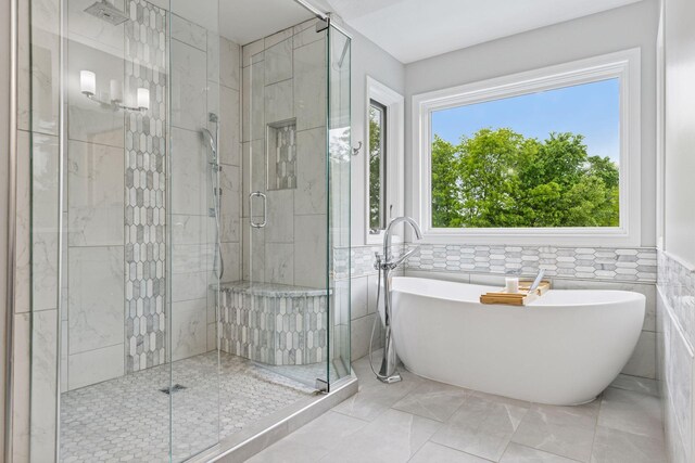 268 Saint Andrews Dr, Hudson, WI 54016 - bathroom featuring a freestanding bath, a stall shower, and tile walls