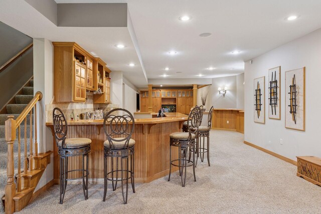 268 Saint Andrews Dr, Hudson, WI 54016 - kitchen featuring light carpet, baseboards, a peninsula, recessed lighting, and light countertops