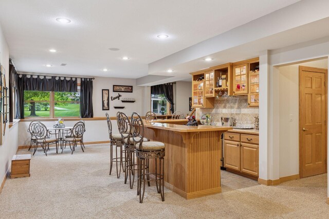 268 Saint Andrews Dr, Hudson, WI 54016 - indoor wet bar with light carpet, recessed lighting, decorative backsplash, and baseboards