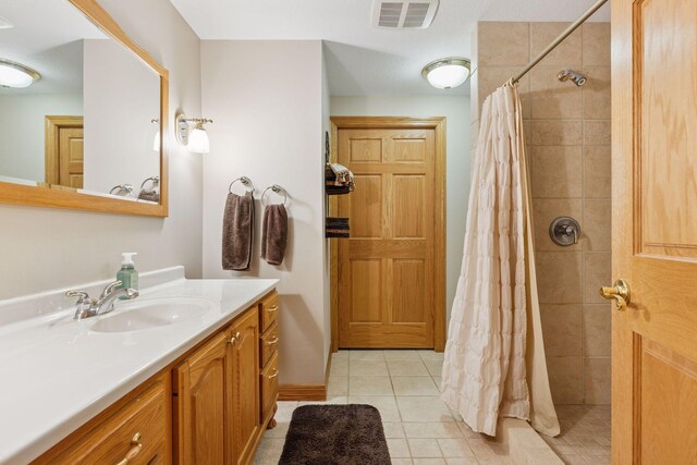 268 Saint Andrews Dr, Hudson, WI 54016 - full bath with vanity, tiled shower, tile patterned floors, and baseboards