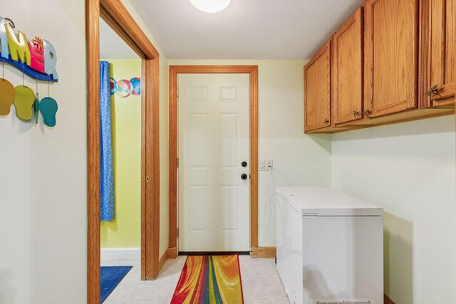 268 Saint Andrews Dr, Hudson, WI 54016 - washroom featuring light tile patterned floors, cabinet space, and baseboards