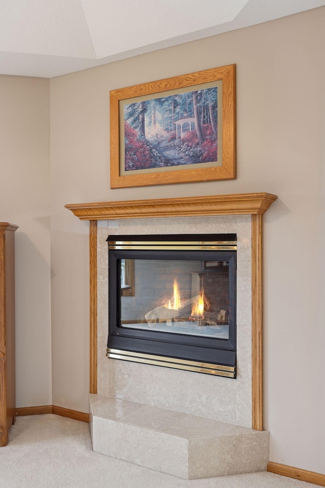 268 Saint Andrews Dr, Hudson, WI 54016 - detailed view of carpet flooring, a glass covered fireplace, and baseboards