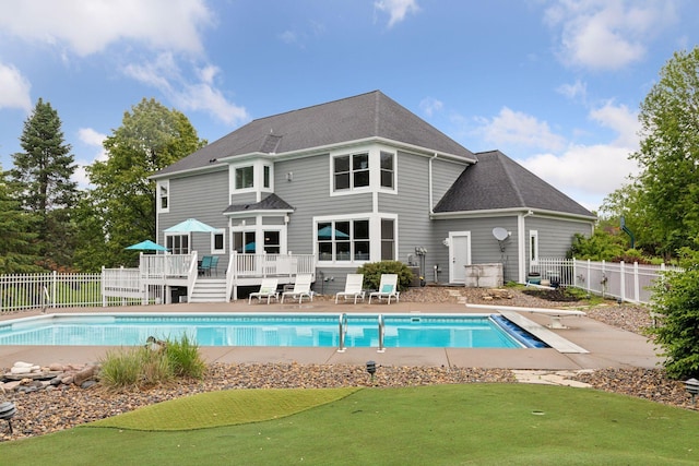 268 Saint Andrews Dr, Hudson, WI 54016 - view of pool with a wooden deck, a fenced backyard, a patio area, and a diving board
