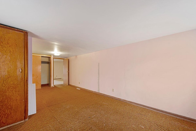101 State Highway 60 E, Elysian, MN 56028 - spare room featuring carpet floors and baseboards