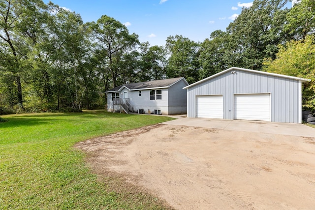 969 Dosh Rd, Fort Ripley, MN 56449 - exterior space with a front yard, a detached garage, and an outdoor structure