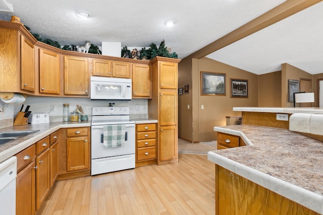 969 Dosh Rd, Fort Ripley, MN 56449 - kitchen featuring lofted ceiling with beams, brown cabinets, light wood finished floors, and white appliances