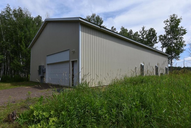 view of home's exterior featuring an outbuilding and a garage
