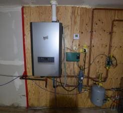 utility room with water heater
