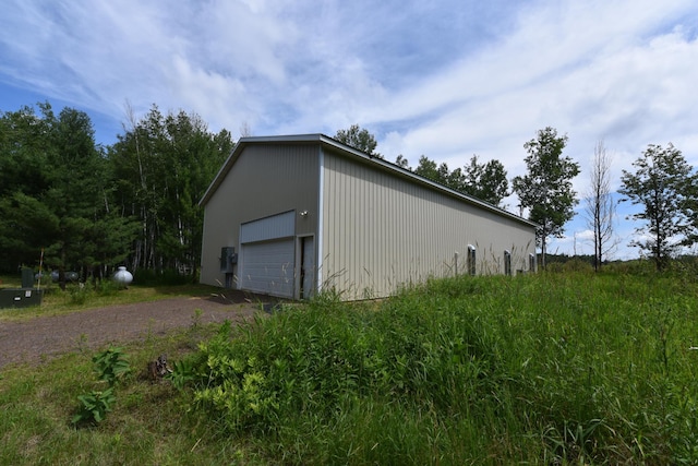 18625 Skunk Lake Rd, Dell Grove Twp, MN 55072 - view of home's exterior featuring a detached garage and an outdoor structure