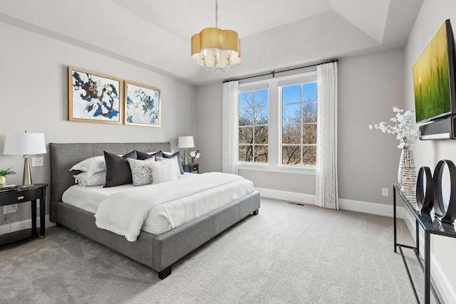 425 Carpenters Pt, Wayzata, MN 55391 - bedroom featuring a chandelier, carpet, baseboards, and a raised ceiling