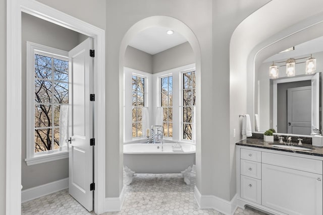 425 Carpenters Pt, Wayzata, MN 55391 - full bath featuring vanity, baseboards, and plenty of natural light