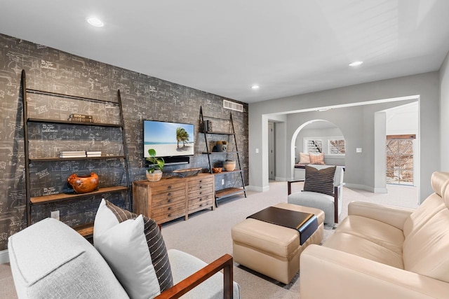 425 Carpenters Pt, Wayzata, MN 55391 - living area featuring carpet, arched walkways, baseboards, recessed lighting, and wallpapered walls