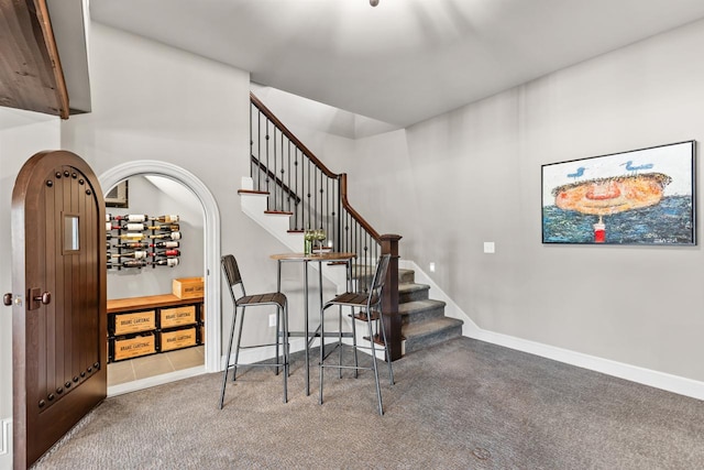 425 Carpenters Pt, Wayzata, MN 55391 - staircase featuring carpet floors and baseboards