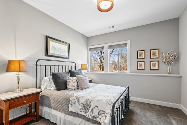 425 Carpenters Pt, Wayzata, MN 55391 - bedroom with dark carpet and baseboards