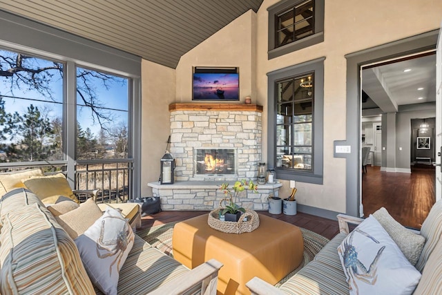425 Carpenters Pt, Wayzata, MN 55391 - living area featuring wood finished floors, vaulted ceiling, a fireplace, baseboards, and recessed lighting