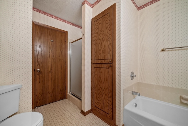 bathroom with wallpapered walls, a bathtub, a shower stall, and toilet