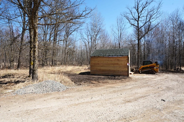 14113 260th St, Dailey Twp, MN 56353 - view of shed with a wooded view