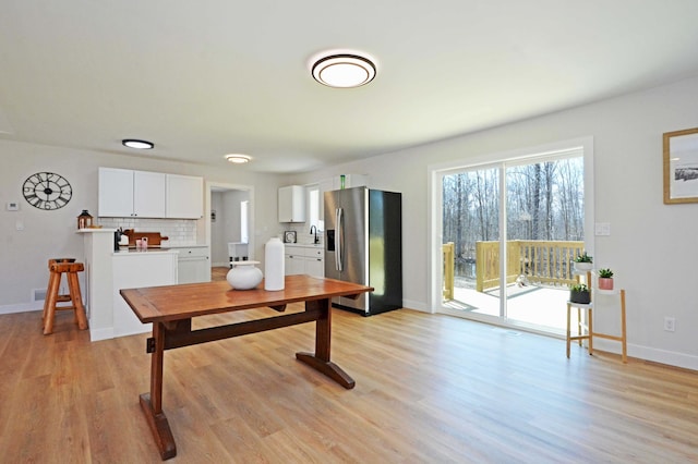 14113 260th St, Dailey Twp, MN 56353 - dining room with light wood-style flooring and baseboards