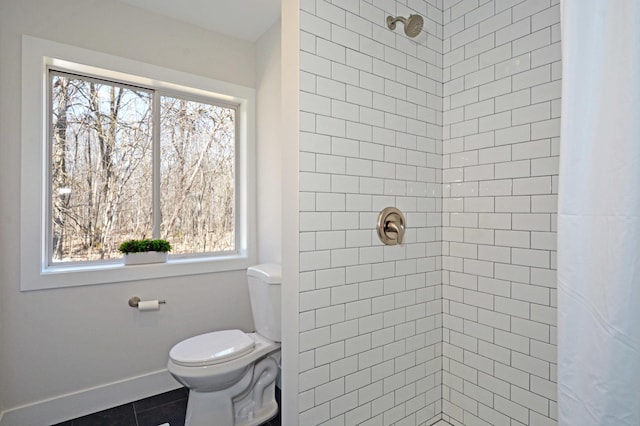 14113 260th St, Dailey Twp, MN 56353 - bathroom featuring healthy amount of natural light, tiled shower, and toilet