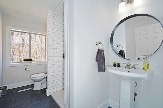 14113 260th St, Dailey Twp, MN 56353 - bathroom featuring a stall shower, toilet, tile patterned flooring, and baseboards
