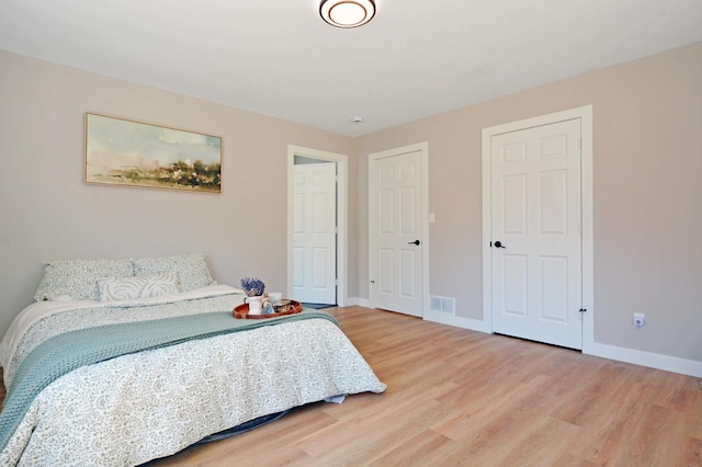 14113 260th St, Dailey Twp, MN 56353 - bedroom with light wood-style floors and baseboards