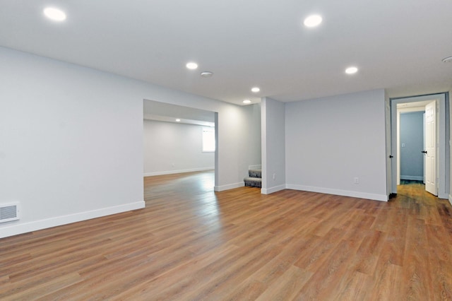 14113 260th St, Dailey Twp, MN 56353 - empty room featuring recessed lighting, stairs, baseboards, and light wood-style flooring