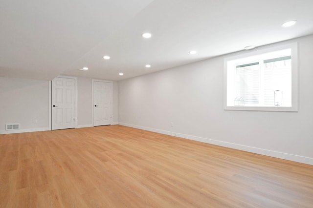 14113 260th St, Dailey Twp, MN 56353 - empty room featuring baseboards, light wood finished floors, and recessed lighting