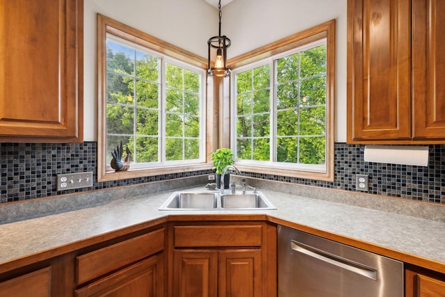 4562 Hummingbird Trl NE, Prior Lake, MN 55372 - kitchen with dishwasher, a sink, decorative backsplash, hanging light fixtures, and brown cabinets