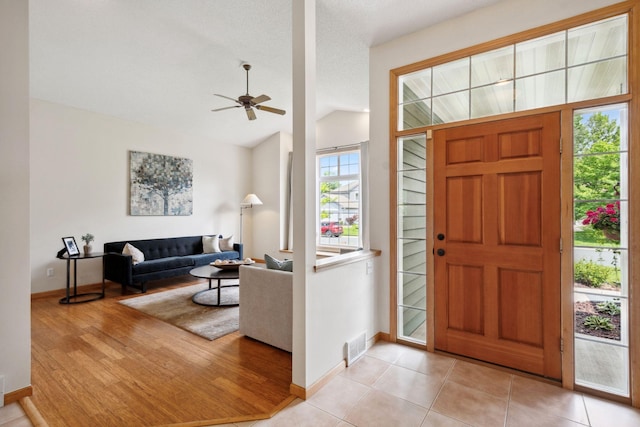 4562 Hummingbird Trl NE, Prior Lake, MN 55372 - foyer entrance with baseboards, lofted ceiling, and ceiling fan