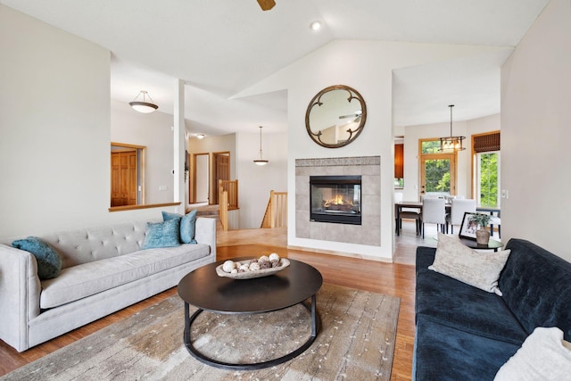 4562 Hummingbird Trl NE, Prior Lake, MN 55372 - living room featuring wood finished floors, vaulted ceiling, and a tile fireplace