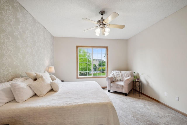 4562 Hummingbird Trl NE, Prior Lake, MN 55372 - carpeted bedroom with baseboards, a ceiling fan, wallpapered walls, and a textured ceiling