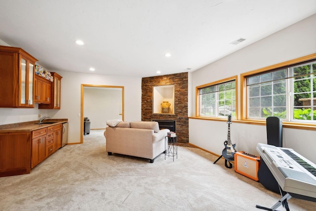 4562 Hummingbird Trl NE, Prior Lake, MN 55372 - living area featuring light colored carpet, baseboards, recessed lighting, and a fireplace