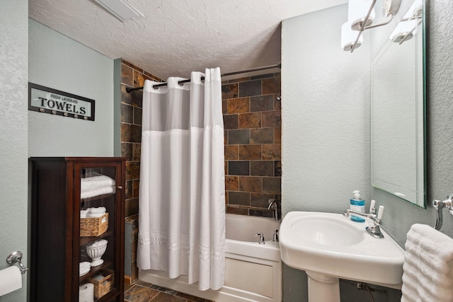 4562 Hummingbird Trl NE, Prior Lake, MN 55372 - bathroom with shower / tub combo with curtain, a textured wall, a sink, and a textured ceiling