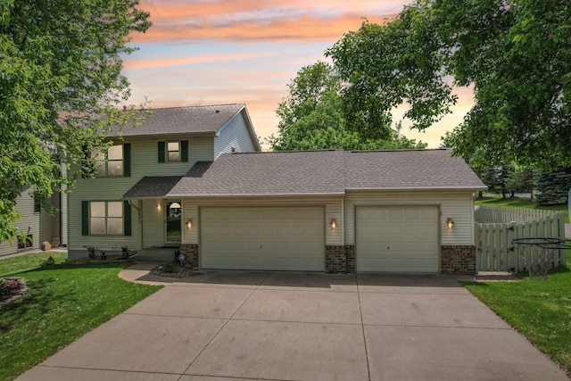 8671 Pheasant Run Rd, Woodbury, MN 55125 - view of front of property with a garage, driveway, brick siding, and a shingled roof