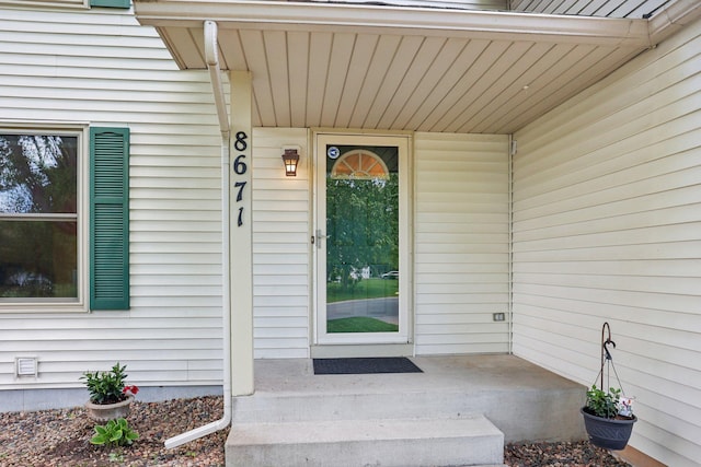 8671 Pheasant Run Rd, Woodbury, MN 55125 - property entrance featuring covered porch