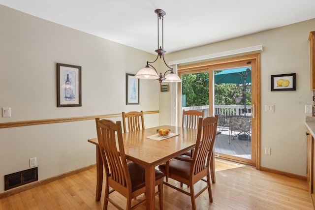 8671 Pheasant Run Rd, Woodbury, MN 55125 - dining space featuring light wood-style floors and baseboards
