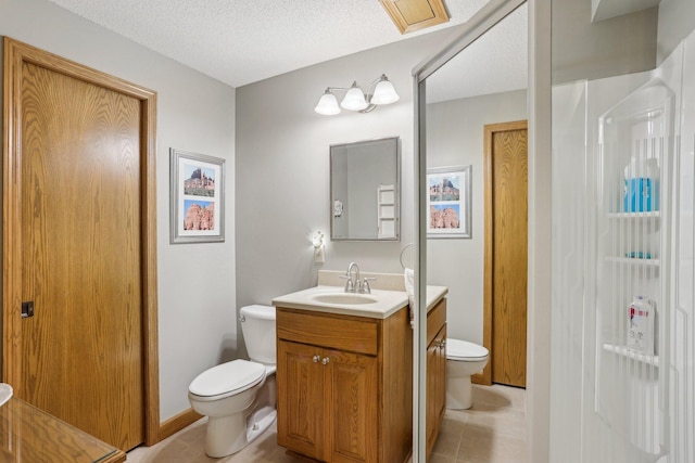 8671 Pheasant Run Rd, Woodbury, MN 55125 - bathroom featuring toilet, vanity, tile patterned floors, a closet, and a textured ceiling